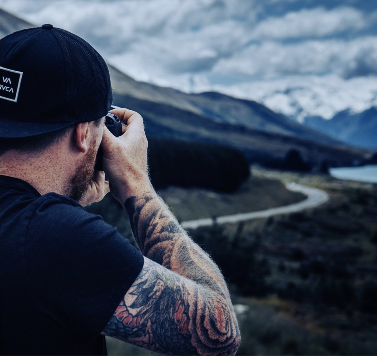 Jacob behind the camera on a mountain road