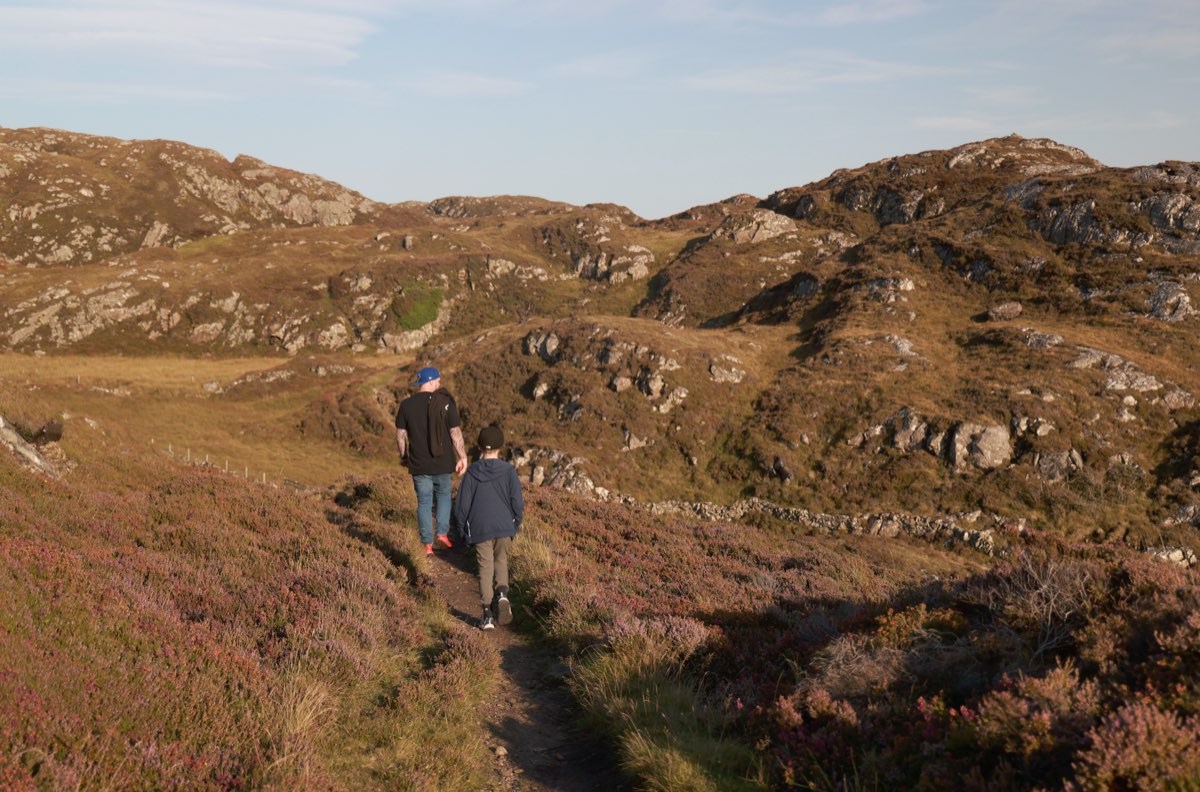 Walking a trail near Lochinver in evening light