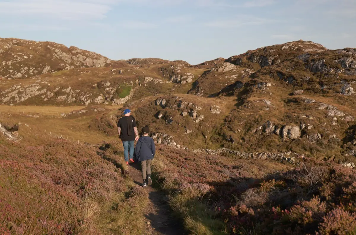 Walking a trail near Lochinver in evening light