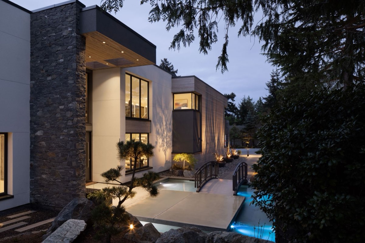 Footbridge to a modern home at twilight