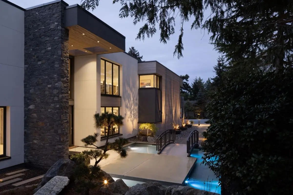 Footbridge to a modern home at twilight