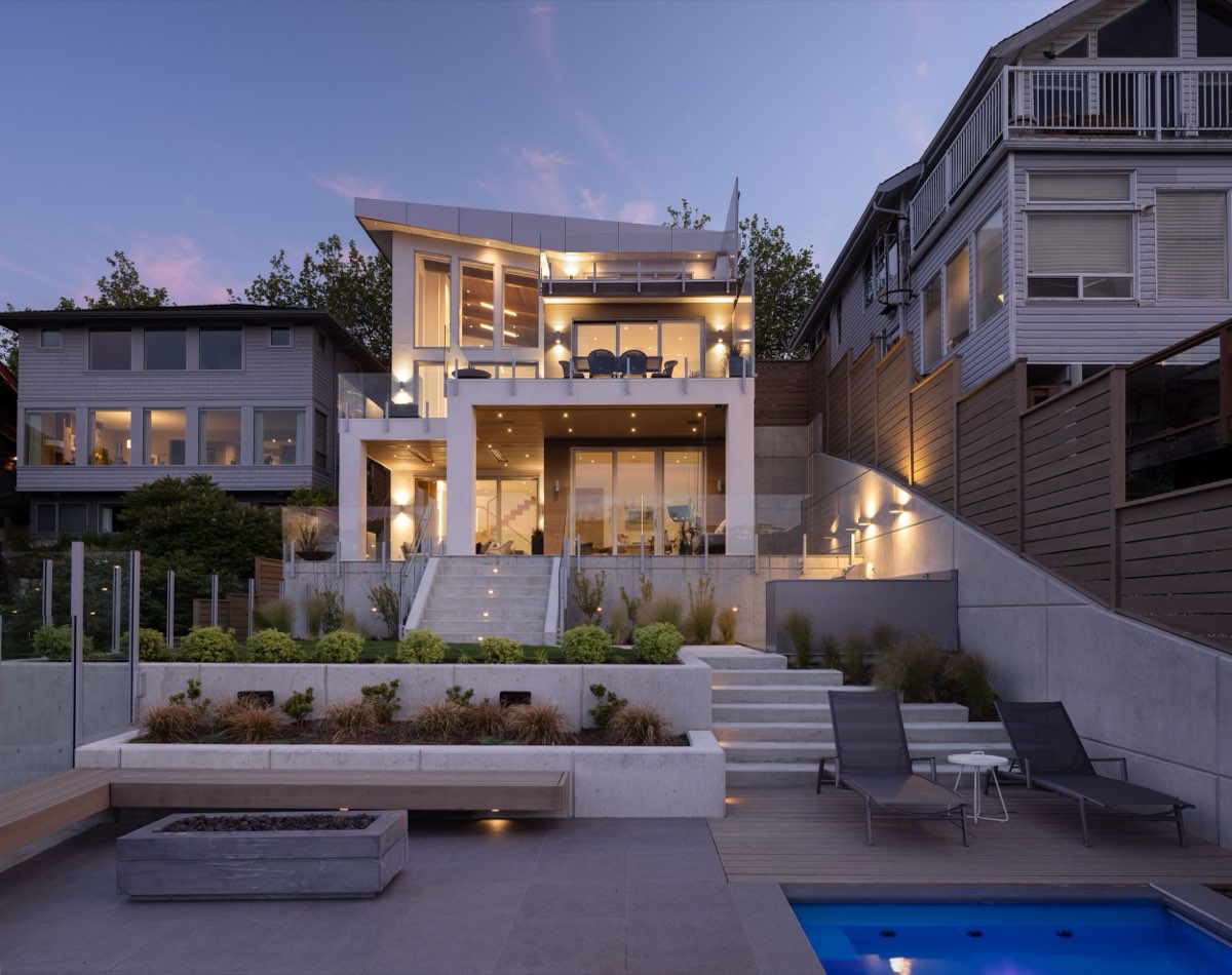 Modern home and pool terrace at dusk