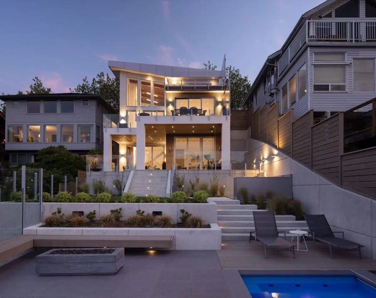 Modern home and pool terrace at dusk