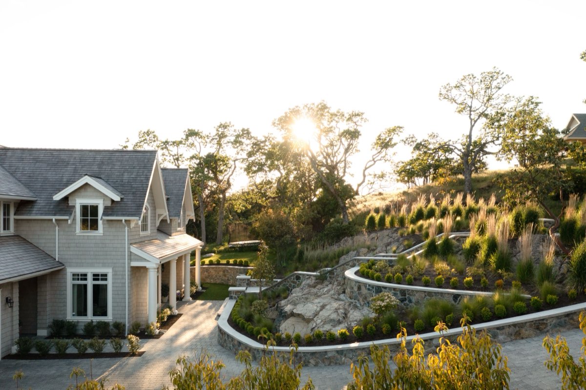Shingled hillside home in the last of the sun