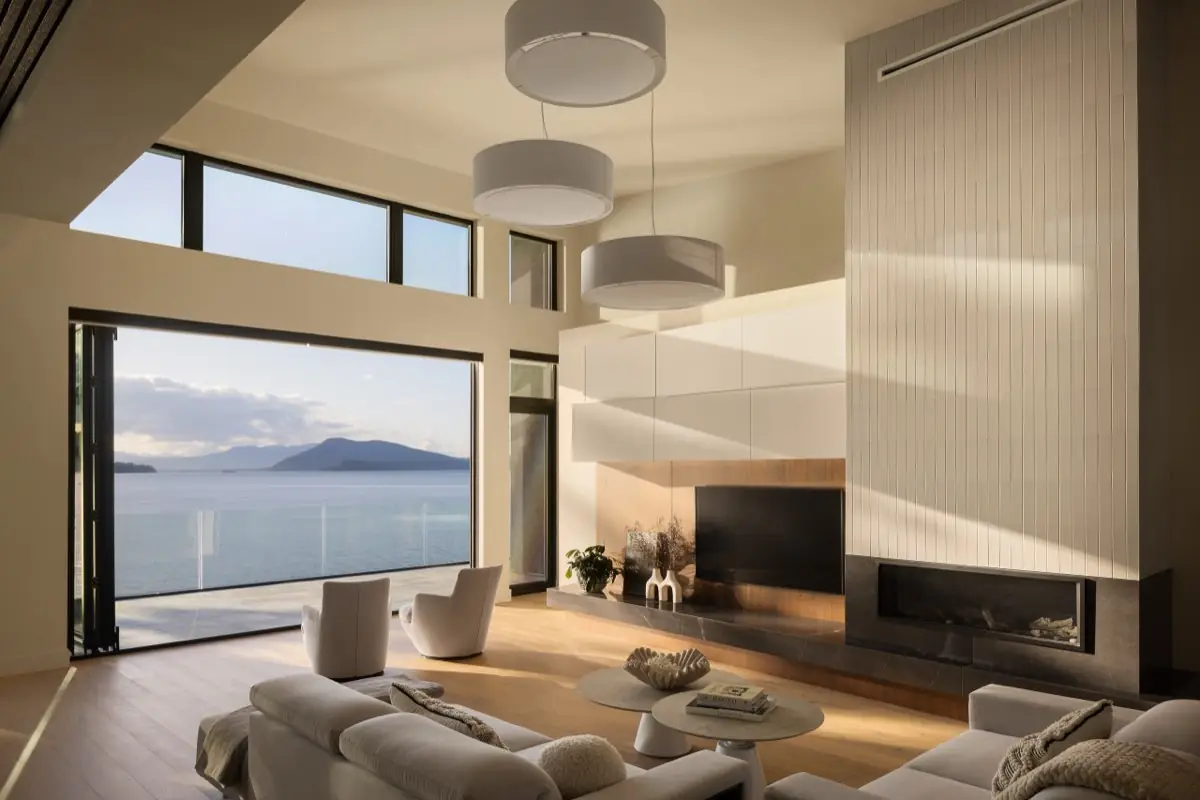 Living room with tall windows onto the strait and the islands