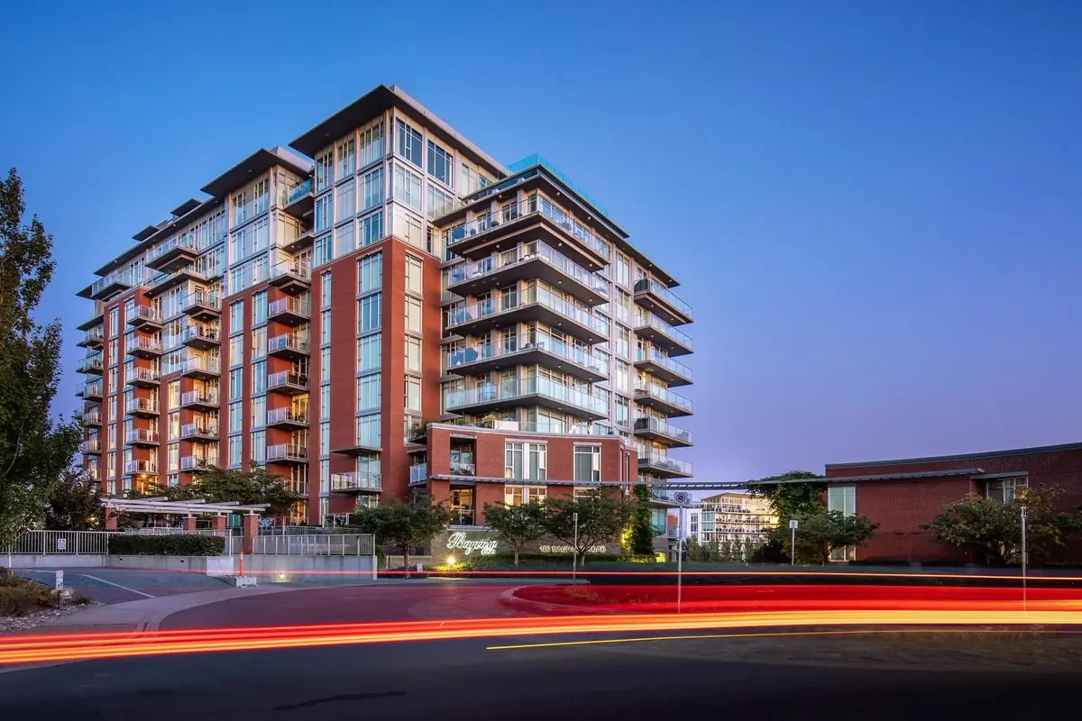 Condominium tower at dusk with light trails, Victoria
