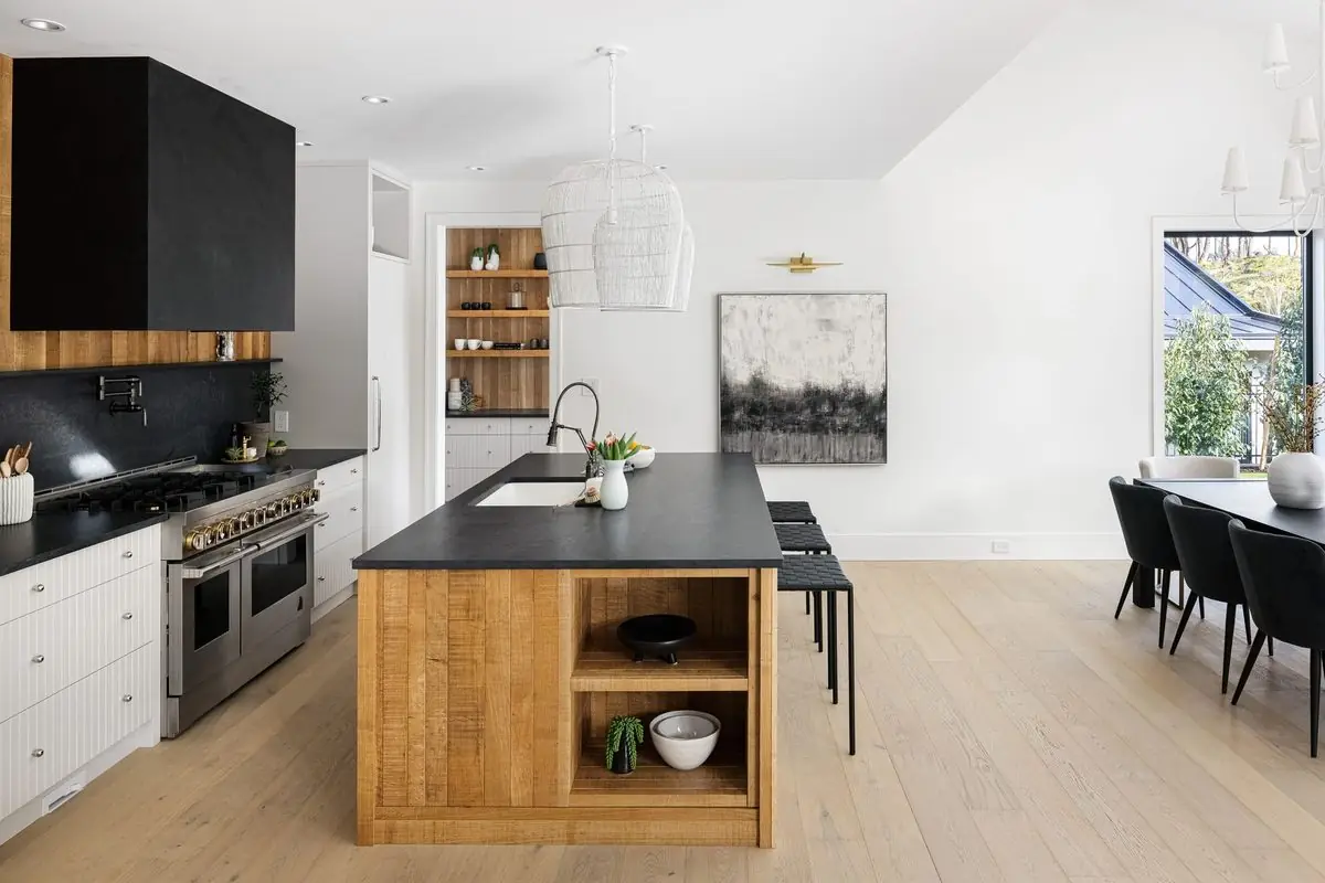 White kitchen with an oak island