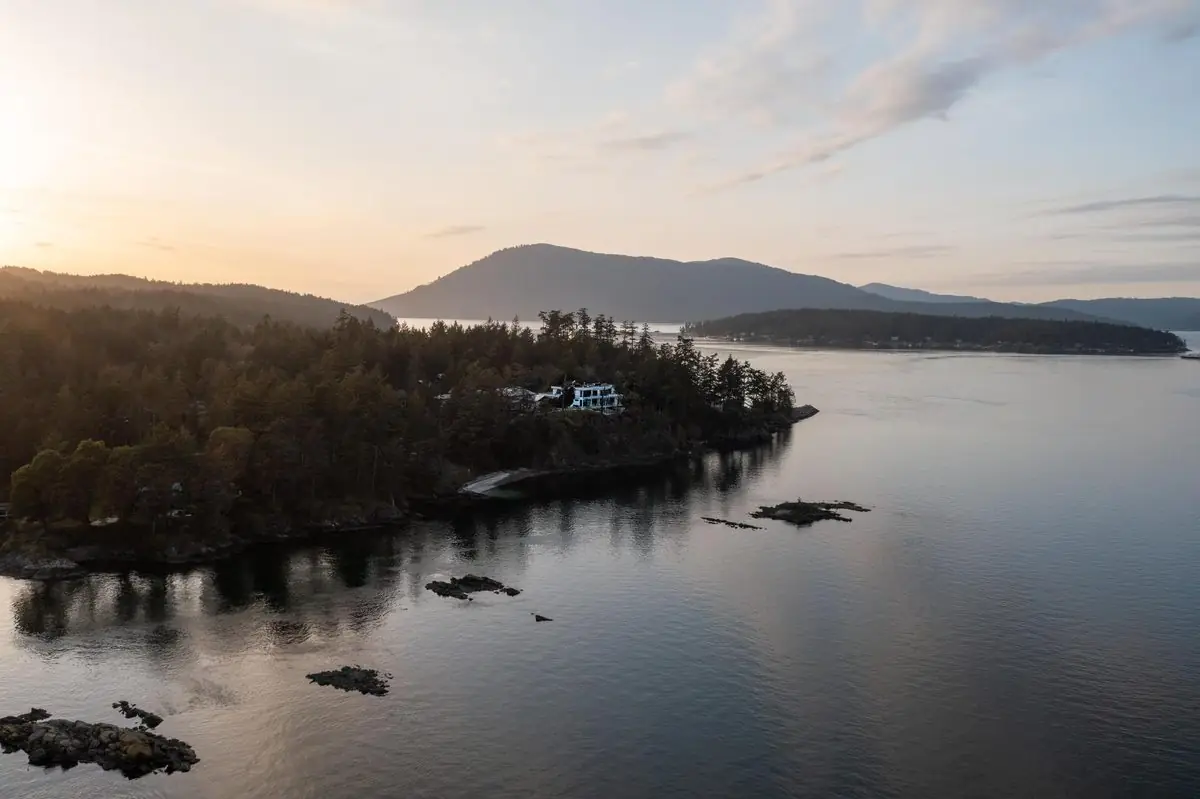 Sunrise over a calm bay and the Gulf Islands