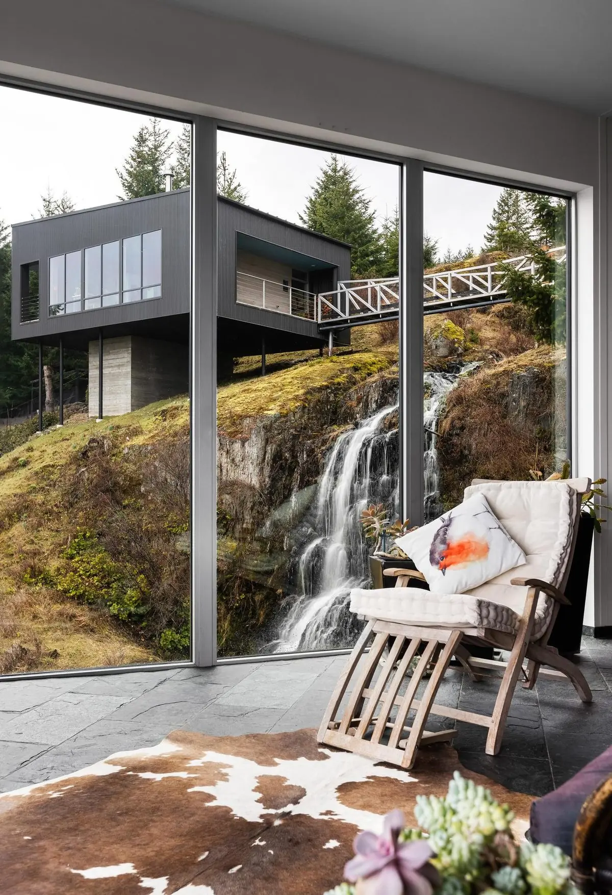 Window seat beside a waterfall, portrait frame
