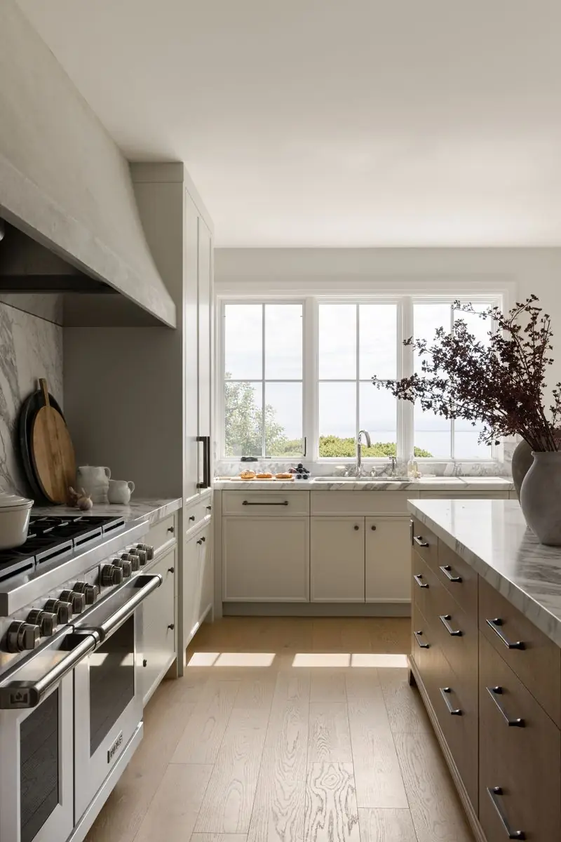 Range under a plaster hood, with the window beyond
