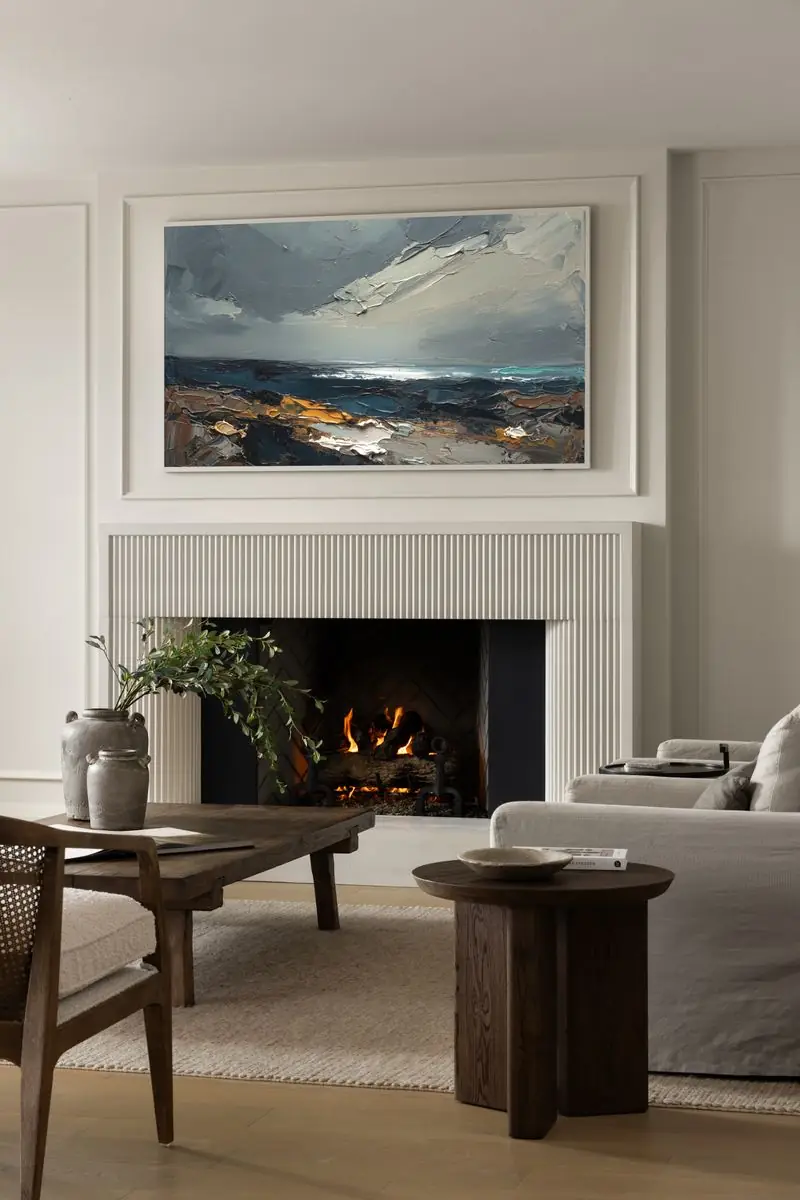 Fireplace and seascape painting