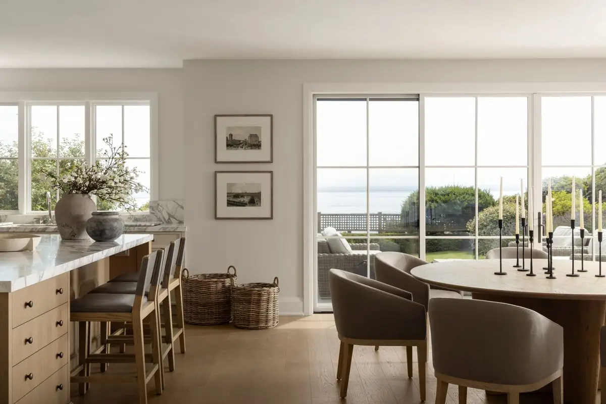 Dining table by the windows, the water beyond
