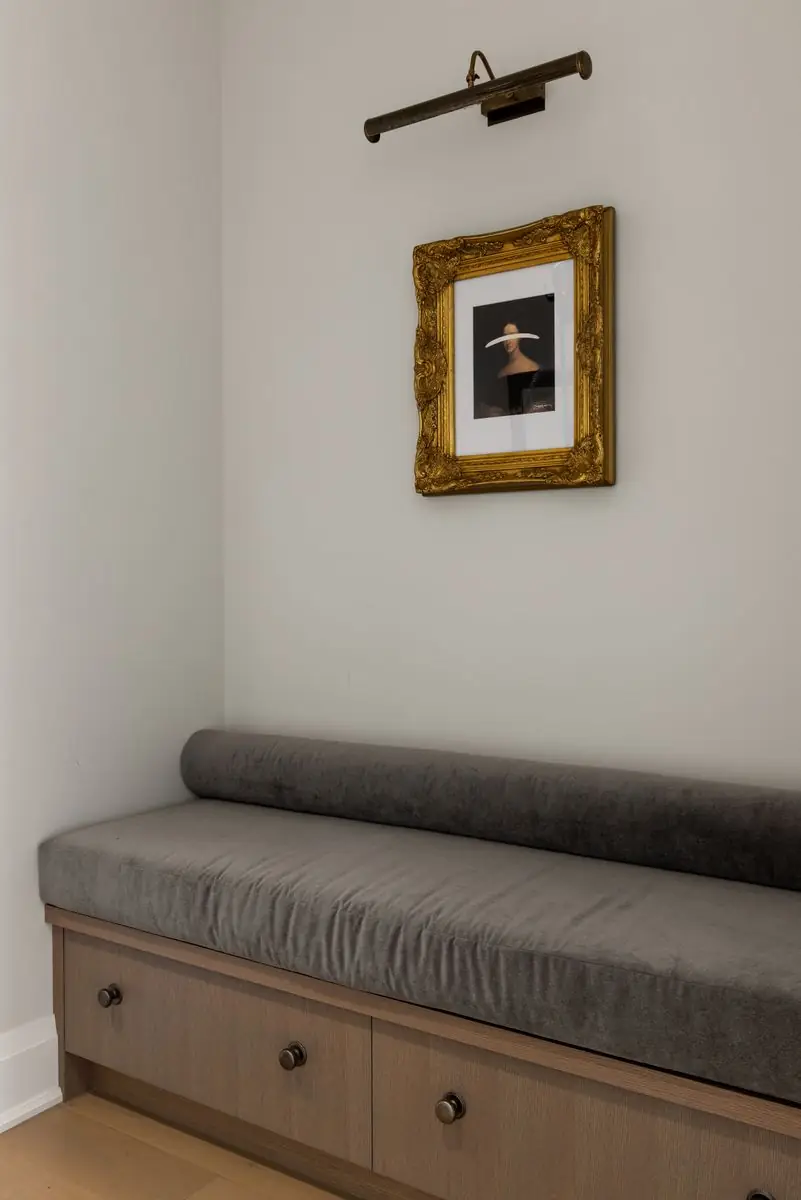 Built-in bench below a framed picture