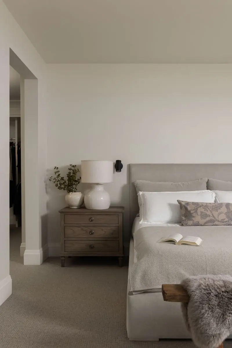 Bedroom with a pale upholstered bed