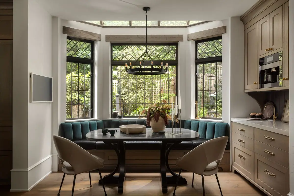 Breakfast nook in a bay of leaded windows