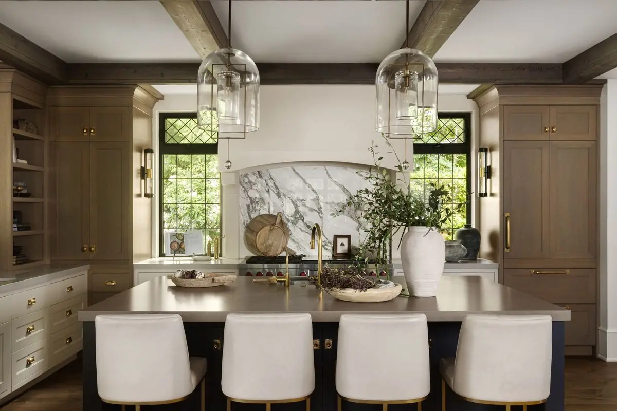 Kitchen island, glass pendants and the range wall