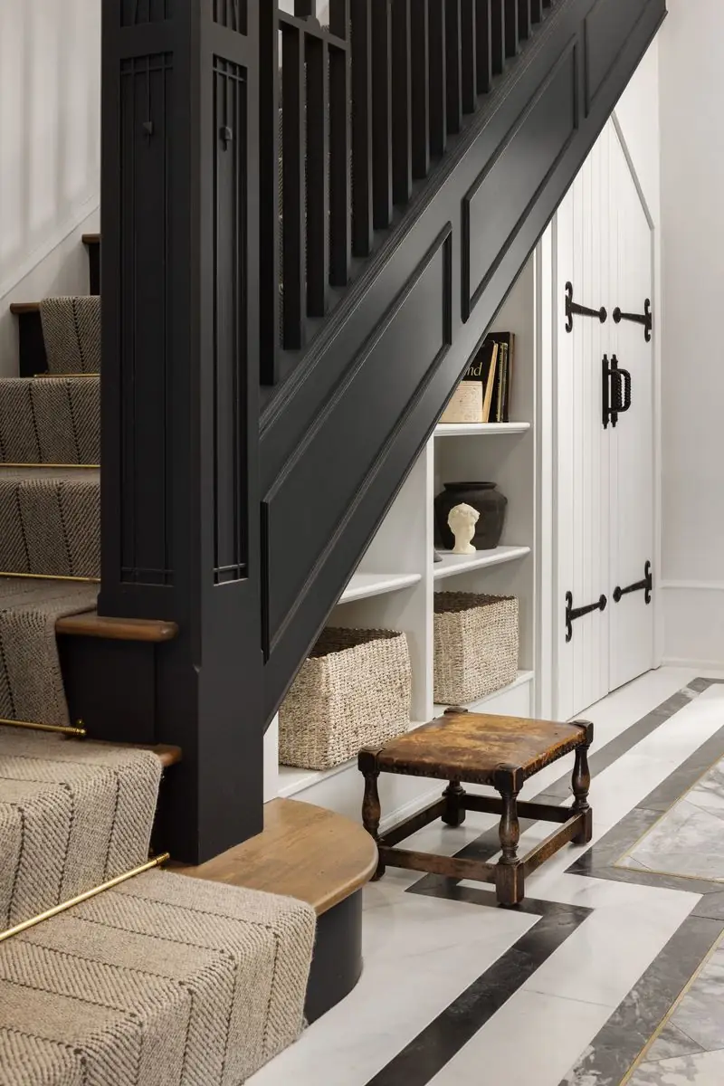 Stair runner, black balusters and under-stair shelving