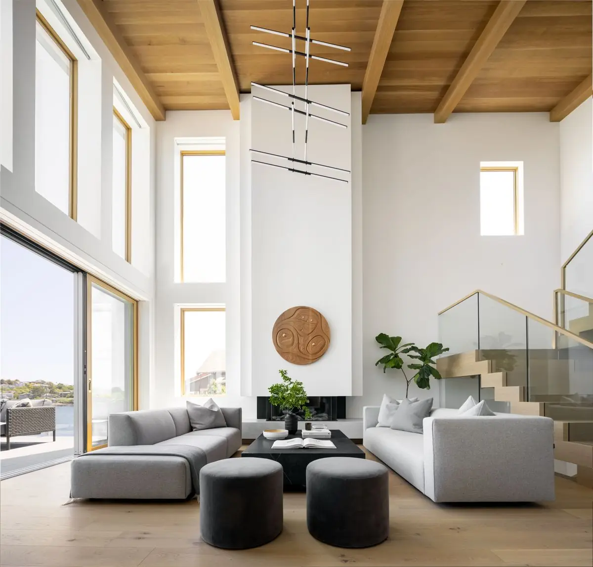 Double-height living room under a timber ceiling