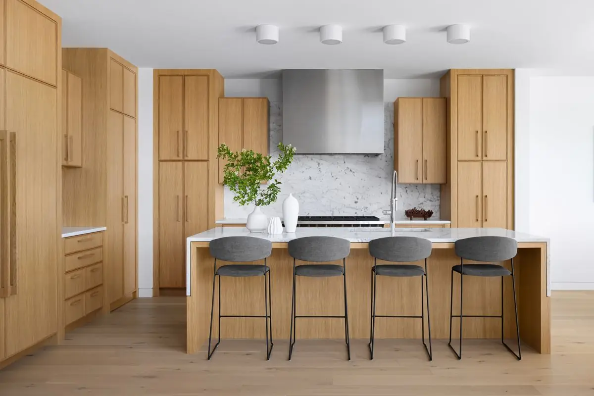 Oak kitchen with four stools at the island