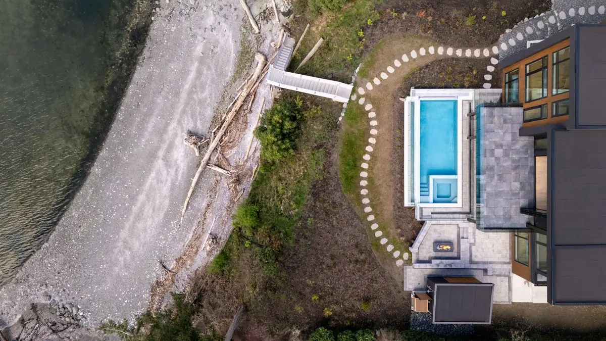 Aerial of the beach, the pool and the house