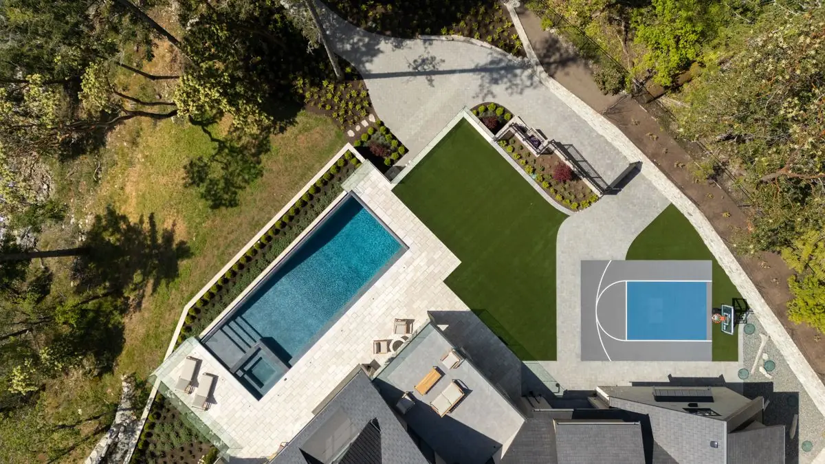 Aerial of the pool, the terrace and the sport court