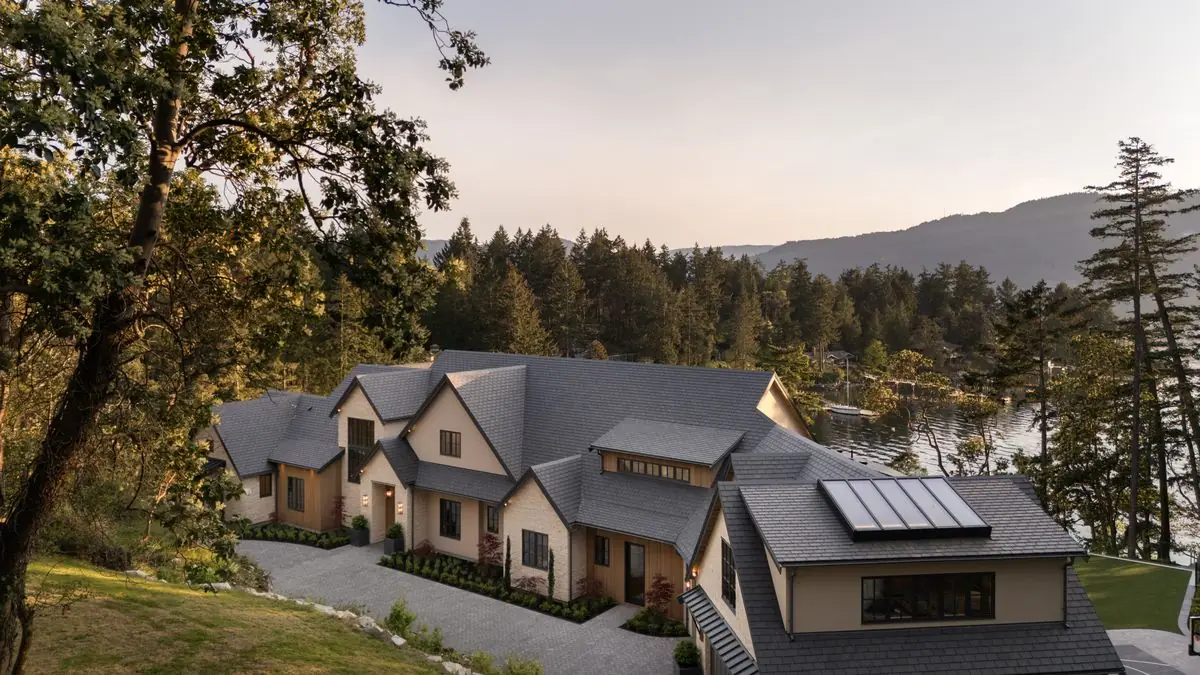 Aerial of the house and its roofs among the trees