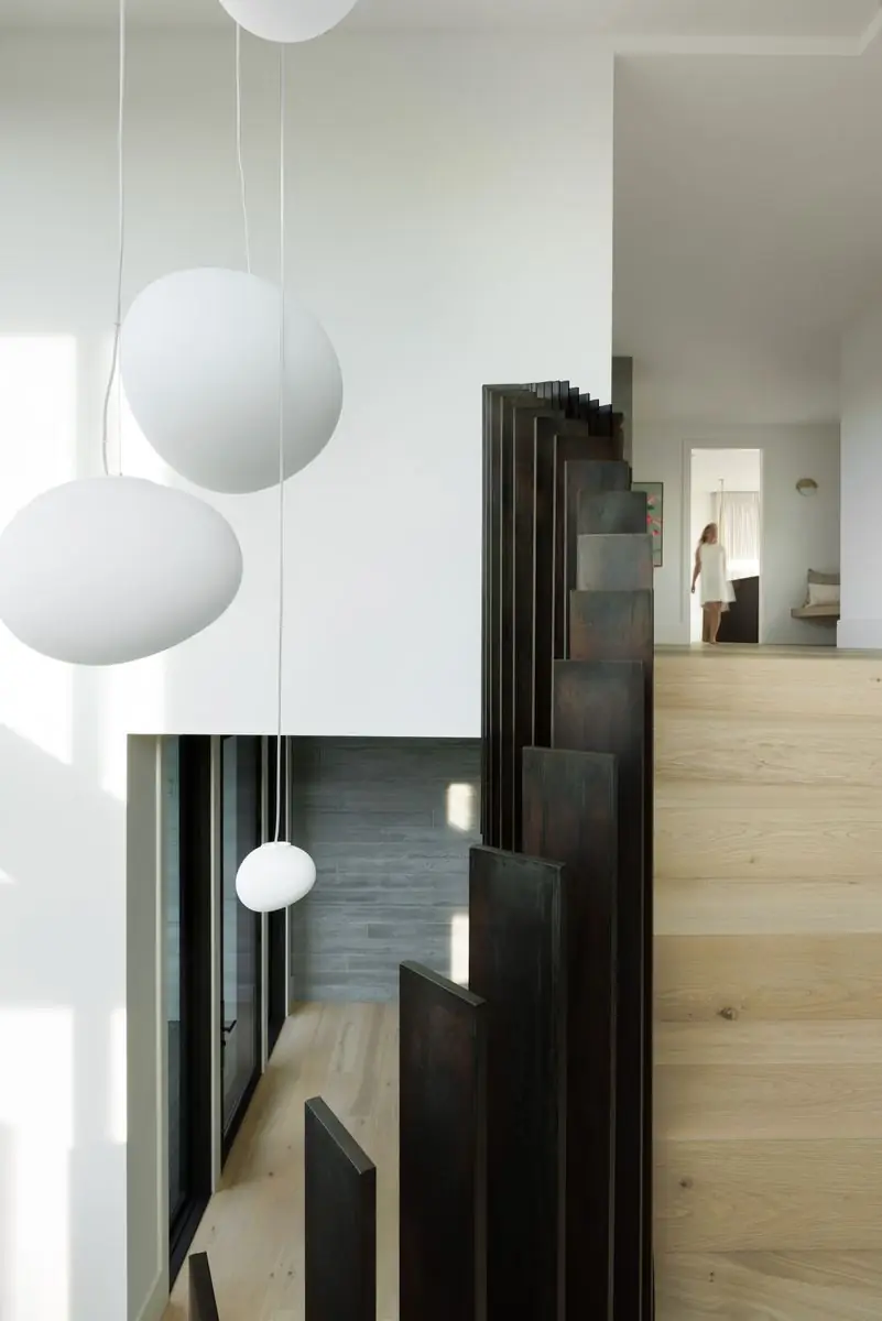 Globe pendants hanging through the stairwell